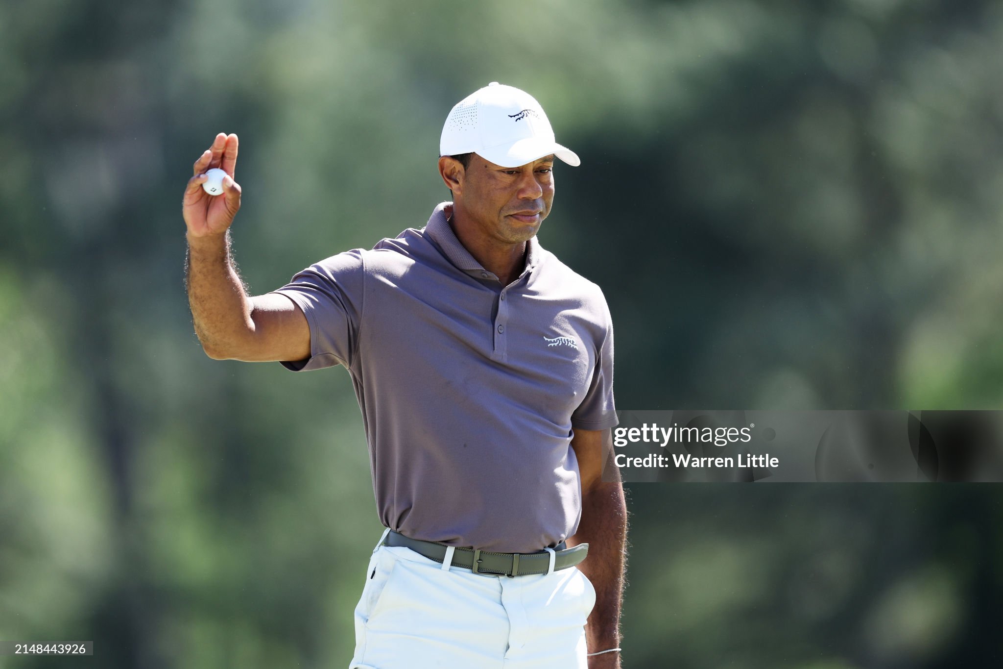 AUGUSTA, GEORGIA - APRIL 12: Tiger Woods of the United States reacts on the 18th green during the second round of the 2024 Masters Tournament at Augusta National Golf Club on April 12, 2024 in Augusta, Georgia. (Photo by Warren Little/Getty Images)