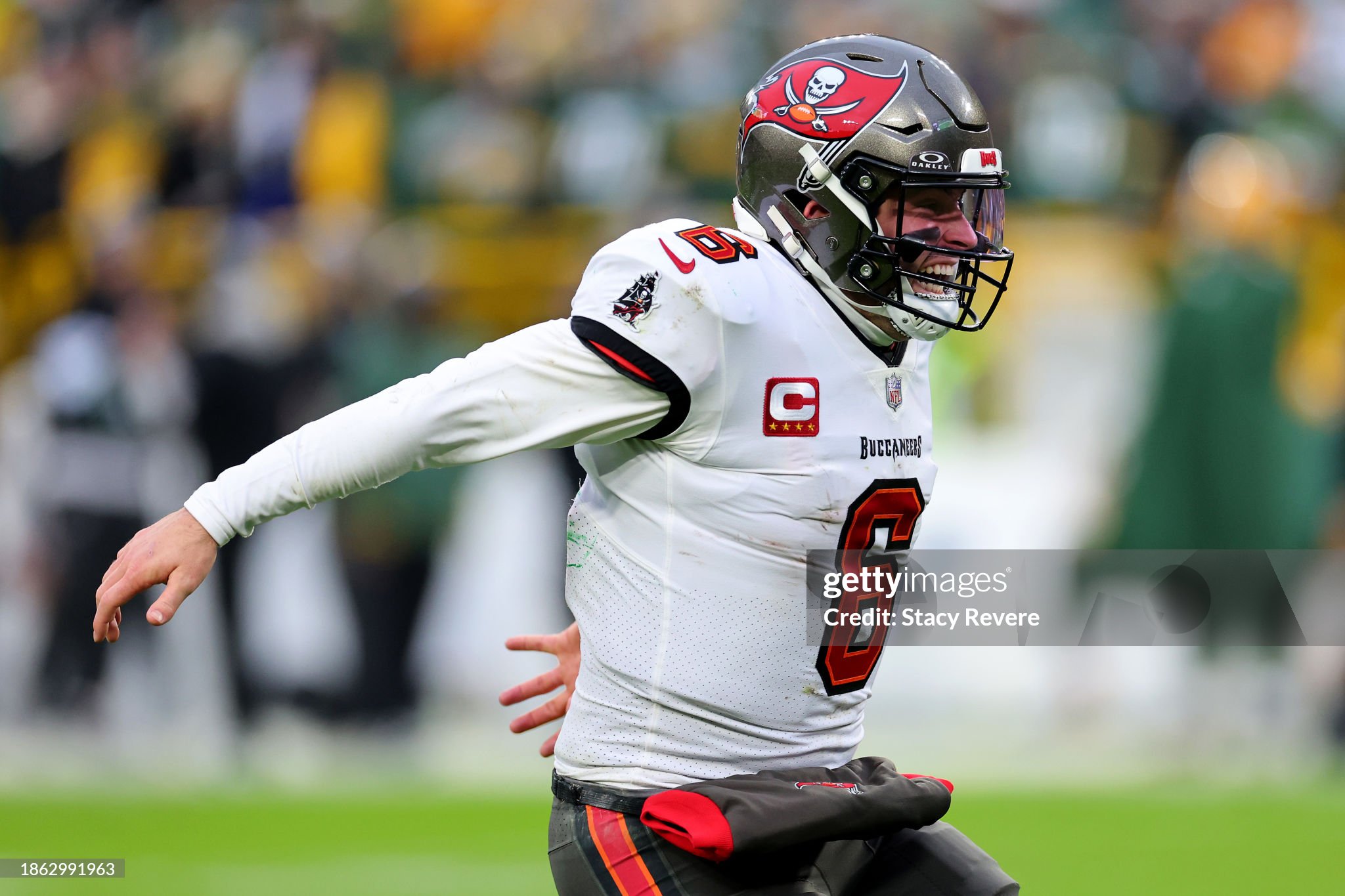 GREEN BAY, WISCONSIN - DECEMBER 17: Baker Mayfield #6 of the Tampa Bay Buccaneers reacts after throwing a touchdown during the fourth quarter against the Green Bay Packers at Lambeau Field on December 17, 2023 in Green Bay, Wisconsin. (Photo by Stacy Revere/Getty Images)